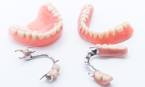 Set of dentures on white background